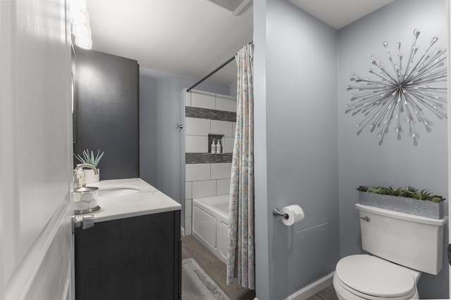 22171 Monterey Dr, Trenton, MI 48183 - full bathroom with toilet, shower / bath combo with shower curtain, wood finished floors, and vanity