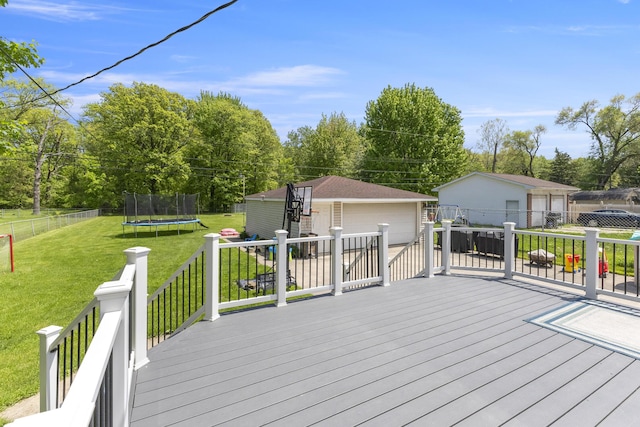 22171 Monterey Dr, Trenton, MI 48183 - deck featuring a trampoline, an outbuilding, and view of scattered trees