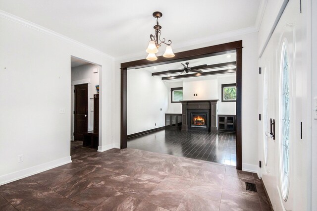 8030 Lionel Dr SW, Byron Center, MI 49315 - unfurnished living room featuring a ceiling fan, crown molding, and a lit fireplace
