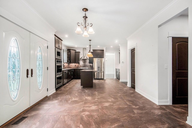 8030 Lionel Dr SW, Byron Center, MI 49315 - entryway with a chandelier, ornamental molding, and recessed lighting