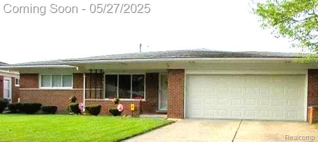 11414 Nancy Dr, Warren, MI 48093 - single story home with brick siding, concrete driveway, an attached garage, and a front yard