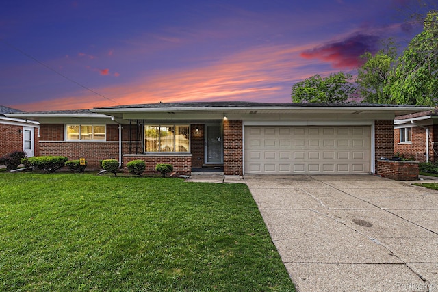 11414 Nancy Dr, Warren, MI 48093 - ranch-style house with a garage, concrete driveway, a yard, and brick siding