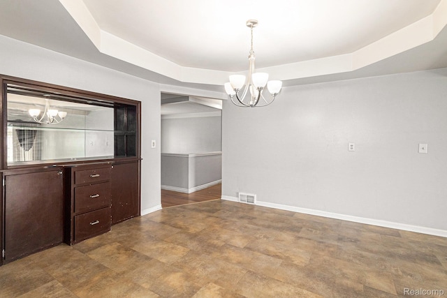 11414 Nancy Dr, Warren, MI 48093 - unfurnished room with a chandelier, a tray ceiling, and baseboards