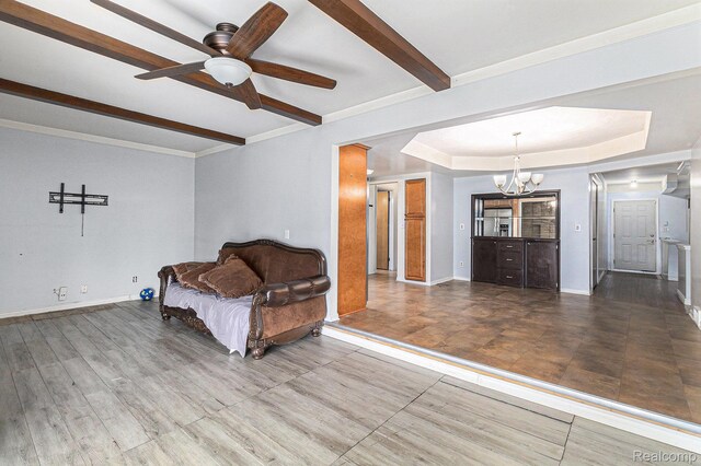 11414 Nancy Dr, Warren, MI 48093 - sitting room featuring a chandelier, beamed ceiling, a ceiling fan, baseboards, and a tray ceiling