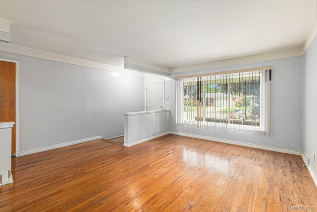 11414 Nancy Dr, Warren, MI 48093 - empty room with hardwood / wood-style floors and baseboards