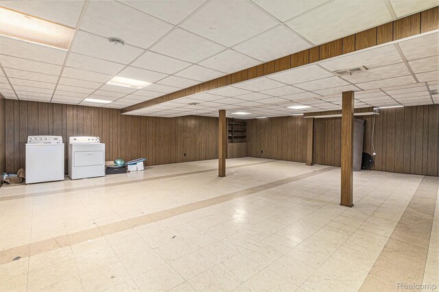 11414 Nancy Dr, Warren, MI 48093 - finished basement with washer and dryer, a paneled ceiling, tile patterned floors, and wooden walls