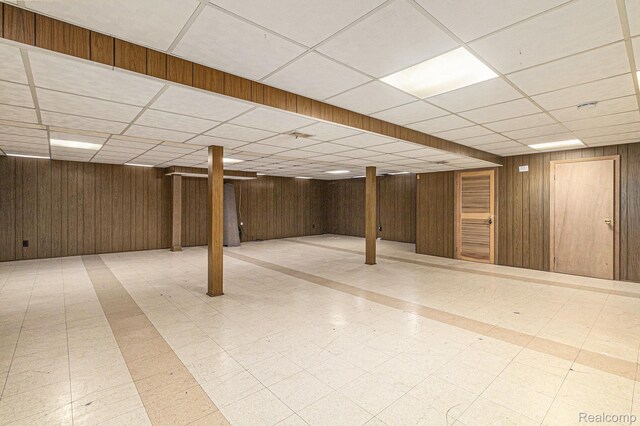 11414 Nancy Dr, Warren, MI 48093 - finished basement featuring a paneled ceiling, tile patterned floors, and wooden walls