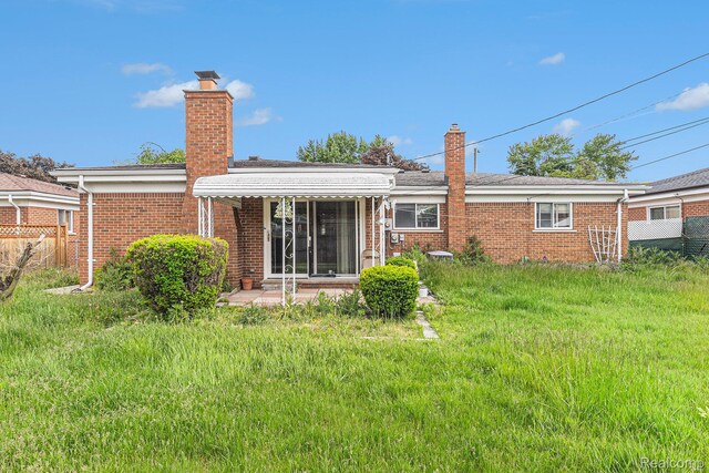 11414 Nancy Dr, Warren, MI 48093 - back of property with a chimney and brick siding