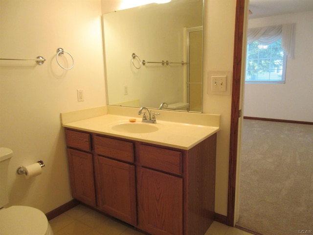 1303 Carriage Dr, Tecumseh, MI 49286 - bathroom with toilet, vanity, and baseboards
