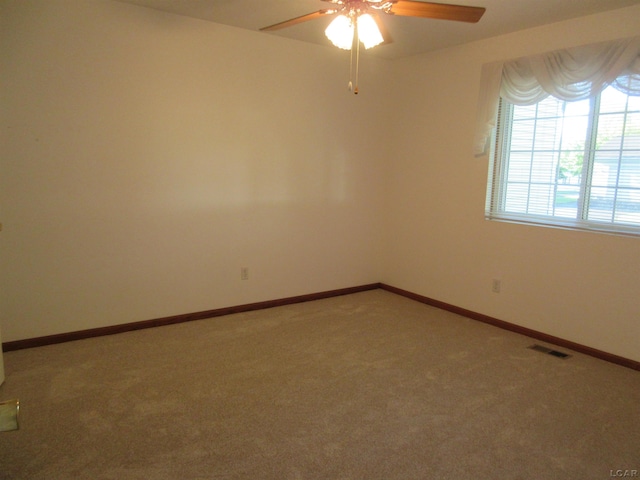 1303 Carriage Dr, Tecumseh, MI 49286 - carpeted empty room featuring ceiling fan and baseboards