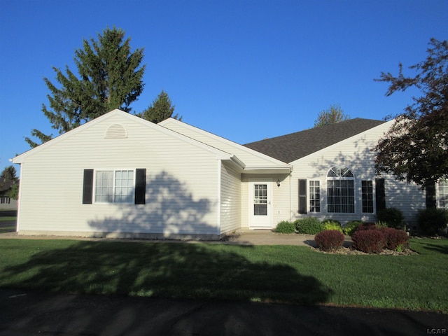 1303 Carriage Dr, Tecumseh, MI 49286 - view of front of home with a front lawn