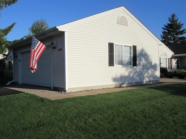 1303 Carriage Dr, Tecumseh, MI 49286 - view of property exterior featuring a lawn