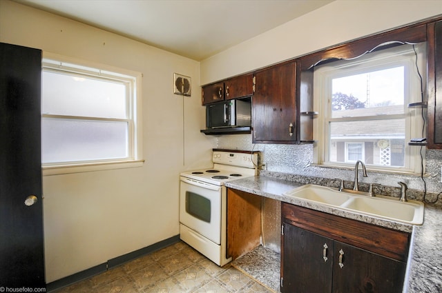 kitchen featuring electric range, a sink, black microwave, backsplash, and dark brown cabinetry