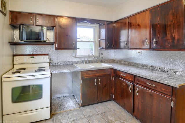 kitchen featuring white electric stove, a sink, tasteful backsplash, and light countertops