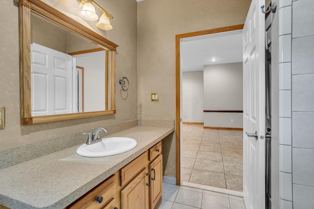186 Goldsmith Dr, Clarklake, MI 49234 - bathroom with tile patterned floors, vanity, and baseboards