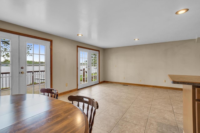186 Goldsmith Dr, Clarklake, MI 49234 - unfurnished dining area with french doors, healthy amount of natural light, light tile patterned flooring, recessed lighting, and baseboards