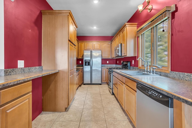 186 Goldsmith Dr, Clarklake, MI 49234 - kitchen featuring appliances with stainless steel finishes, a sink, light tile patterned flooring, recessed lighting, and brown cabinets
