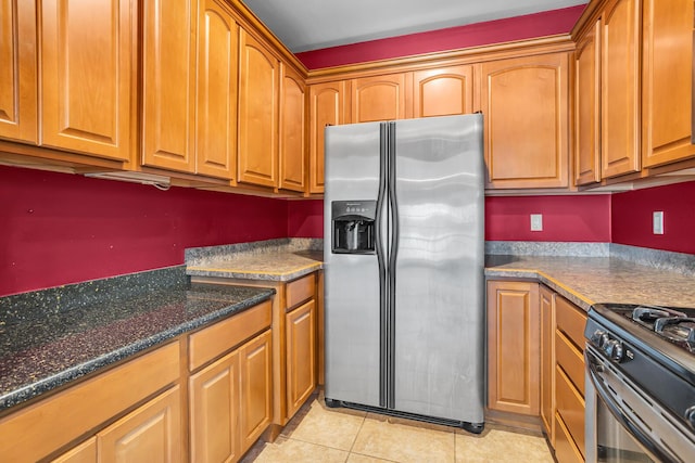 186 Goldsmith Dr, Clarklake, MI 49234 - kitchen featuring stainless steel refrigerator with ice dispenser, light tile patterned floors, and brown cabinets