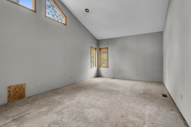 186 Goldsmith Dr, Clarklake, MI 49234 - carpeted empty room with plenty of natural light and high vaulted ceiling
