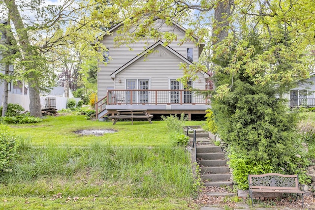 186 Goldsmith Dr, Clarklake, MI 49234 - back of house featuring a wooden deck, stairs, and fence
