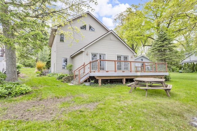186 Goldsmith Dr, Clarklake, MI 49234 - rear view of house featuring a deck, a yard, and french doors