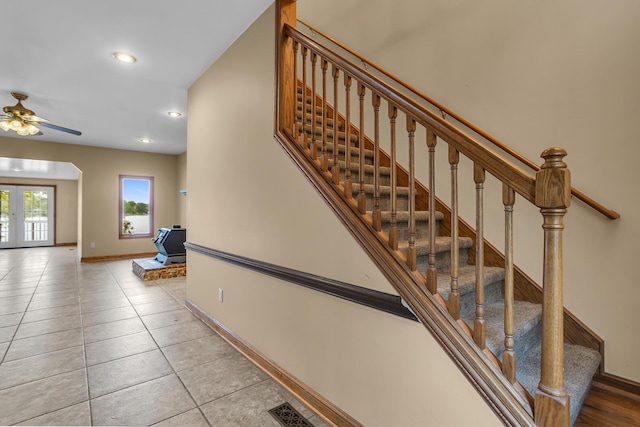 186 Goldsmith Dr, Clarklake, MI 49234 - stairway featuring baseboards, tile patterned floors, recessed lighting, a ceiling fan, and french doors