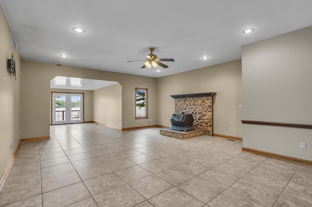 186 Goldsmith Dr, Clarklake, MI 49234 - unfurnished living room with a wood stove, a ceiling fan, light tile patterned floors, recessed lighting, and baseboards