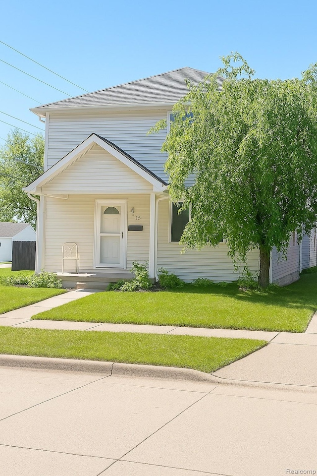 2205 Regina Ave, Lincoln Park, MI 48146 - view of front of property with covered porch and a front lawn