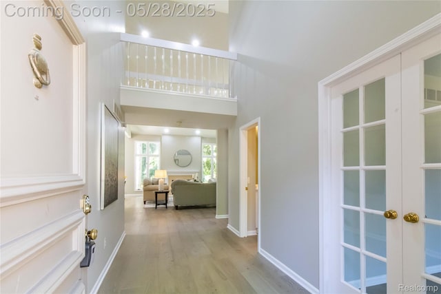 22170 Orchard Way, Beverly Hills, MI 48025 - corridor featuring wood finished floors, baseboards, and french doors
