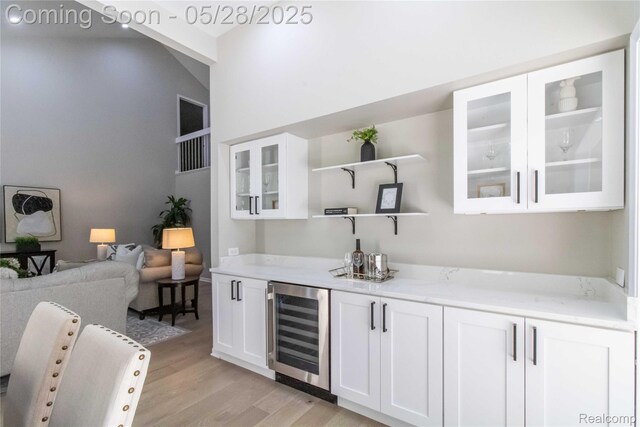 22170 Orchard Way, Beverly Hills, MI 48025 - indoor dry bar featuring wine cooler and light wood-style floors