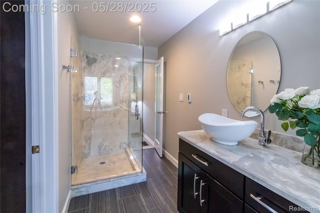 22170 Orchard Way, Beverly Hills, MI 48025 - bathroom with vanity, a stall shower, baseboards, and wood finished floors
