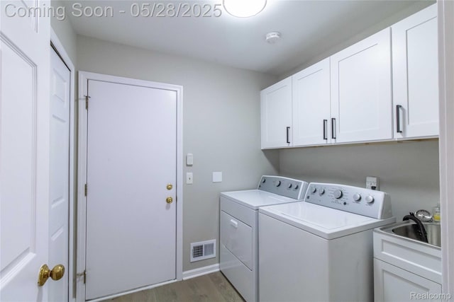 22170 Orchard Way, Beverly Hills, MI 48025 - washroom featuring cabinet space, washing machine and clothes dryer, and dark wood-type flooring