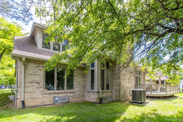 22170 Orchard Way, Beverly Hills, MI 48025 - back of property featuring central AC, brick siding, a lawn, and a deck