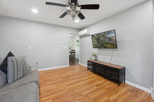 1008 Park St, Tecumseh, MI 49286 - living room featuring a wall mounted air conditioner, a ceiling fan, light wood-style floors, baseboards, and recessed lighting