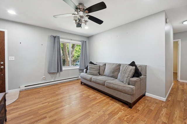 1008 Park St, Tecumseh, MI 49286 - living room featuring a baseboard radiator, light wood-style floors, ceiling fan, recessed lighting, and baseboards