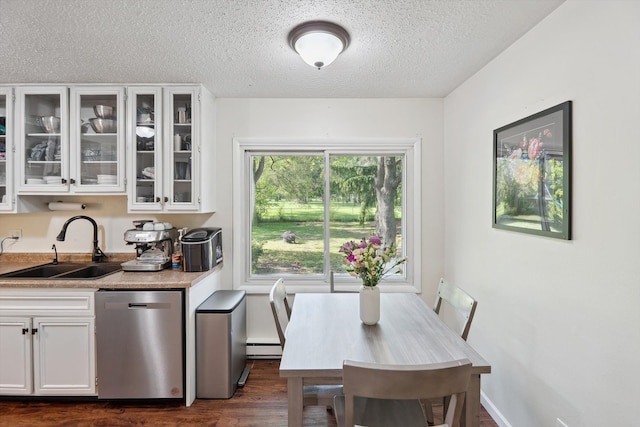 1008 Park St, Tecumseh, MI 49286 - dining room with a textured ceiling, dark wood-type flooring, and a baseboard radiator