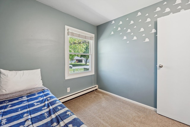 1008 Park St, Tecumseh, MI 49286 - bedroom with a baseboard heating unit, carpet, and baseboards