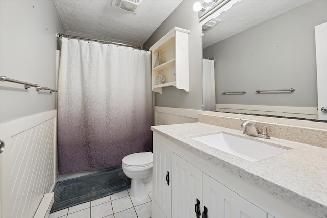 1008 Park St, Tecumseh, MI 49286 - full bathroom featuring tile patterned flooring, vanity, toilet, and a shower with shower curtain