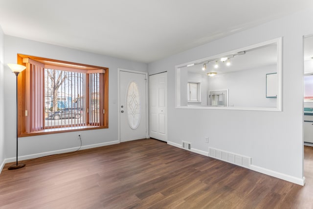 15945 Horger Ave, Allen Park, MI 48101 - entryway with wood finished floors, baseboards, and track lighting