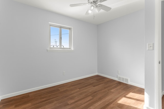 15945 Horger Ave, Allen Park, MI 48101 - empty room with dark wood-type flooring, a ceiling fan, and baseboards