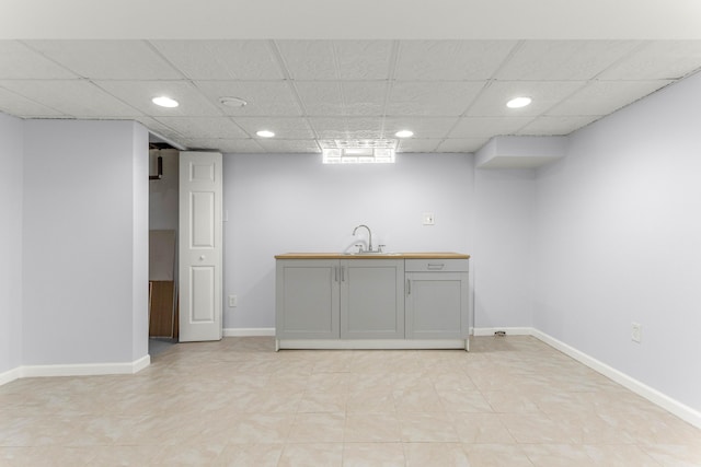 15945 Horger Ave, Allen Park, MI 48101 - bar area featuring baseboards, recessed lighting, a sink, and a paneled ceiling