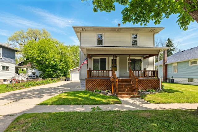 1410 12th St, Port Huron, MI 48060 - traditional style home with covered porch, an outbuilding, a front yard, and a garage