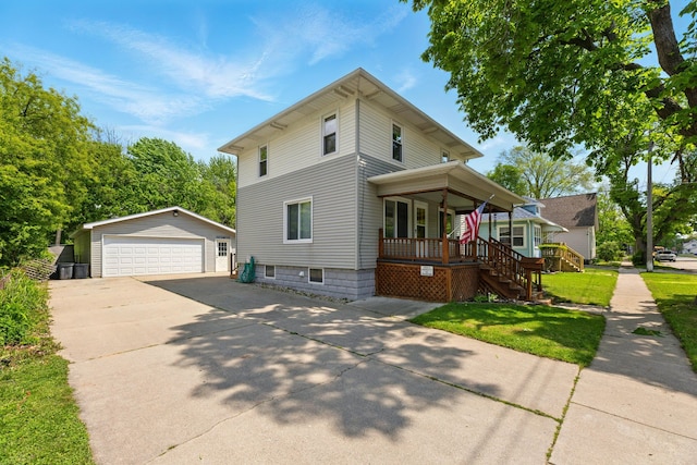 1410 12th St, Port Huron, MI 48060 - view of front of property featuring a porch, an outdoor structure, a detached garage, stairs, and a front lawn