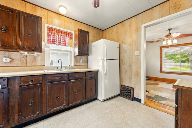 1410 12th St, Port Huron, MI 48060 - kitchen featuring freestanding refrigerator, a sink, light countertops, and a ceiling fan