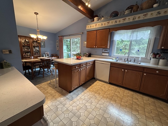 300 Maplecrest Ave, Sturgis, MI 49091 - kitchen featuring white dishwasher, a sink, a peninsula, light countertops, and a chandelier