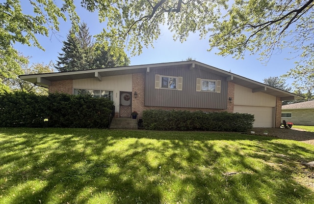 300 Maplecrest Ave, Sturgis, MI 49091 - view of front of house featuring brick siding, a front yard, and an attached garage