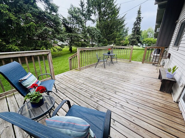 300 Maplecrest Ave, Sturgis, MI 49091 - wooden deck featuring a lawn and view of scattered trees