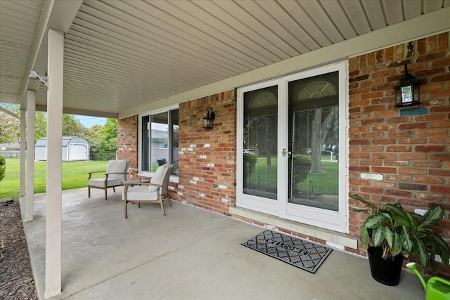 6557 N Twindale, Shelby Twp, MI 48316 - view of patio / terrace featuring covered porch and an outdoor structure