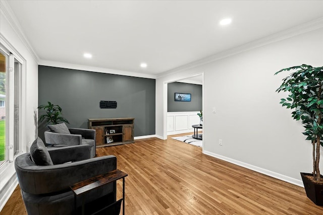 6557 N Twindale, Shelby Twp, MI 48316 - living room with healthy amount of natural light, ornamental molding, light wood finished floors, recessed lighting, and baseboards