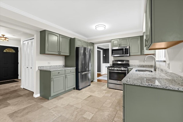 6557 N Twindale, Shelby Twp, MI 48316 - kitchen featuring green cabinets, appliances with stainless steel finishes, a sink, stone tile flooring, and light stone counters